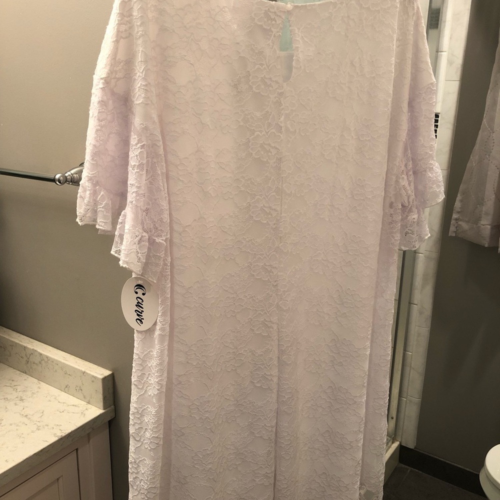 Beautiful white lace flared sleeve dress.